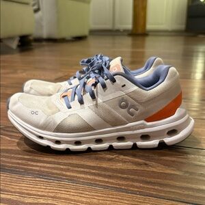 On Running Cream and Orange Athletic Shoes